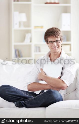 Attractive man on the couch at home