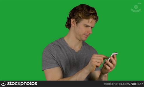 Attractive man texting (Green Key)