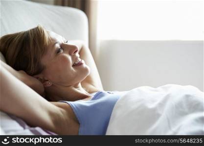 Attractive Middle Aged Woman Waking Up In Bed