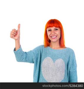 Attractive redhead girl saying Ok isolated on a white background