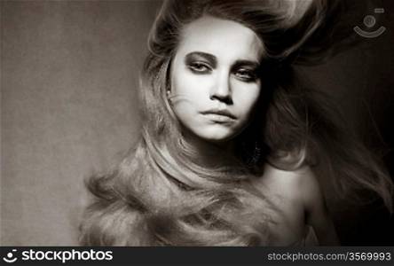 Attractive Romantic Girl with Windy Hair in Shadows