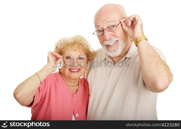 Attractive senior couple wearing glasses. Isolated on white.