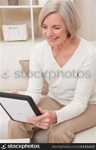 Attractive Senior Woman Using a Tablet Computer