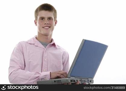 Attractive Sixteen Year Old Boy with Laptop Computer. Shot in studio over white.