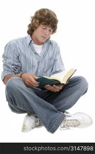 Attractive Sixteen Year Old Teen Boy reading book in casual over white background. Light brown curly hair and hazel eyes.