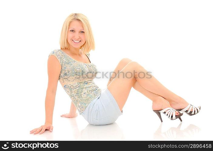 Attractive smiling blonde posing over white background