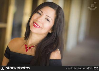 Attractive Smiling Hispanic Woman Portrait Outside.