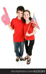 Attractive teen couple supporting their favorite sports team or political party. Full body isolated on white.