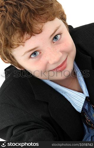 Attractive ten year old american boy in baggy blue suit over white background.