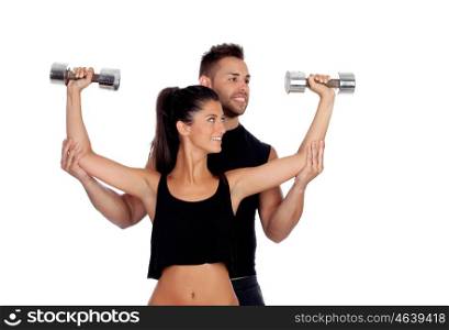 Attractive woman and a personal trainer with weight training