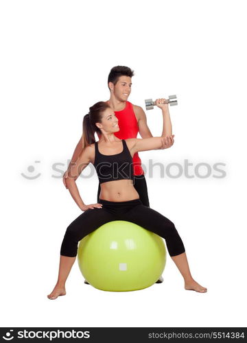 Attractive woman and a personal trainer with weight training