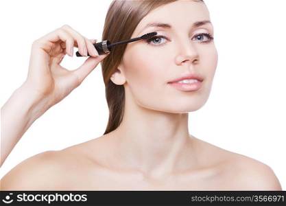 attractive woman and mascara brush on white background