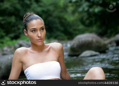 Attractive woman by the water&rsquo;s edge