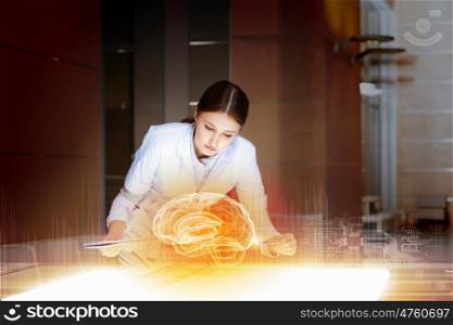 Attractive woman doctor. Image of young woman doctor. Concept of modern technology