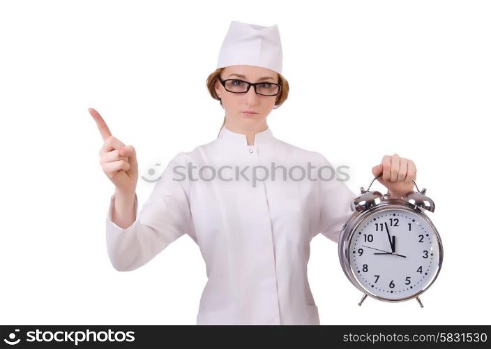 Attractive woman doctor with big clock pressing virtual buttons isolated on white