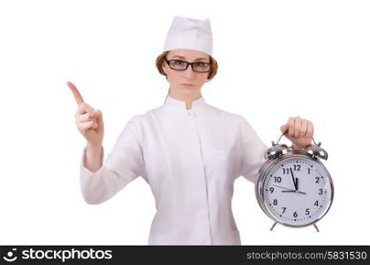 Attractive woman doctor with big clock pressing virtual buttons isolated on white