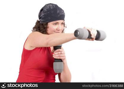 Attractive woman doing exercises with weights