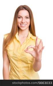 Attractive woman doing OK sign over white background