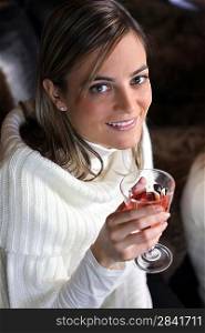 Attractive woman drinking a cocktail