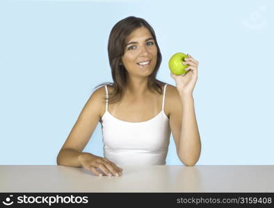 Attractive woman eating an apple
