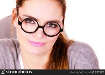 Attractive woman face, female businesswoman wearing glasses portrait, serious face expression on white. Young serious business woman looking