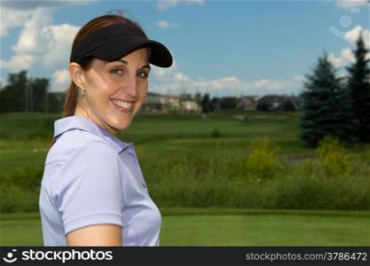 Attractive woman golfer on the golf course