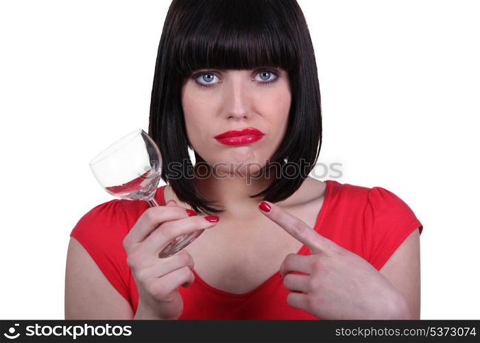 attractive woman holding an empty glass
