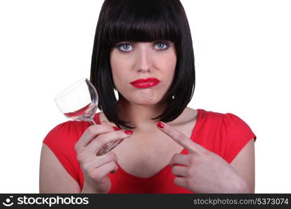 attractive woman holding an empty glass