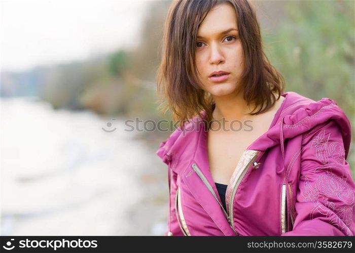 attractive woman in a pink jacket