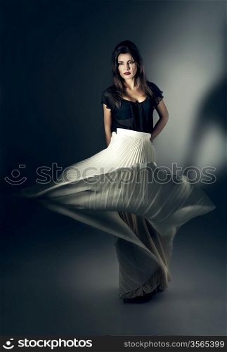 attractive woman in flying white skirt