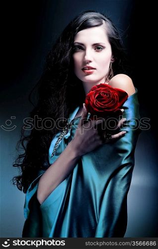 attractive woman in green fabric with rose