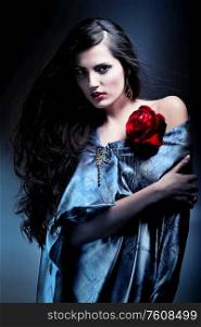 attractive woman in grey fabric with red rose