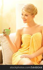 attractive woman in spa salon with a cup
