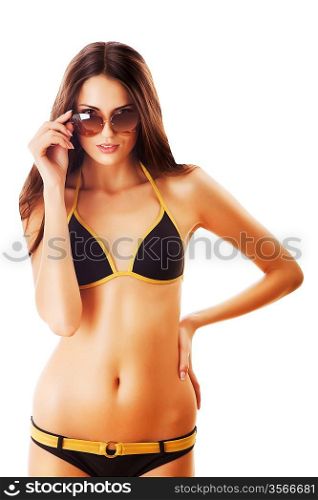 attractive woman in sunglasses looks at you on white background
