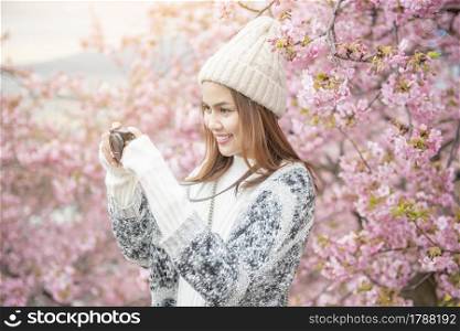 Attractive woman is enjoying with Cherry Blossom in Matsuda , Japan