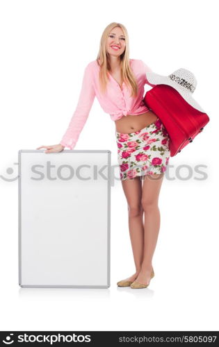 Attractive woman preparing for vacation with suitcase and blank board isolated on white