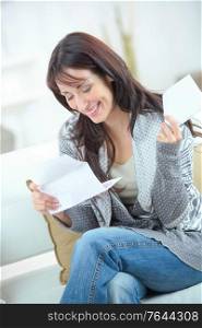 attractive woman reading a letter