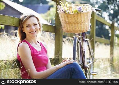 Attractive Woman Relaxing On Walk In Countryside