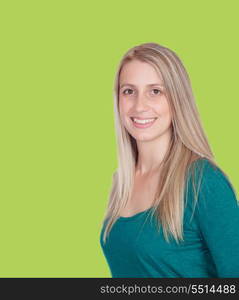 Attractive woman smiling on a green background