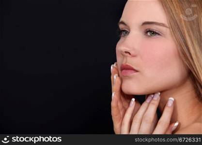 Attractive woman touching face