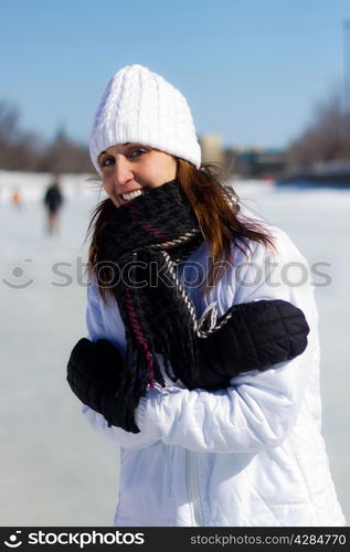 Attractive woman tries to keep warm during the cold winter