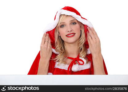 Attractive woman wearing a red cape