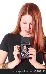 attractive woman wearing shirt is holding old photocamera. isolated.