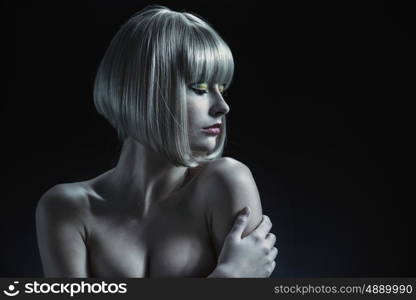 Attractive woman with a blond hairpiece on her head