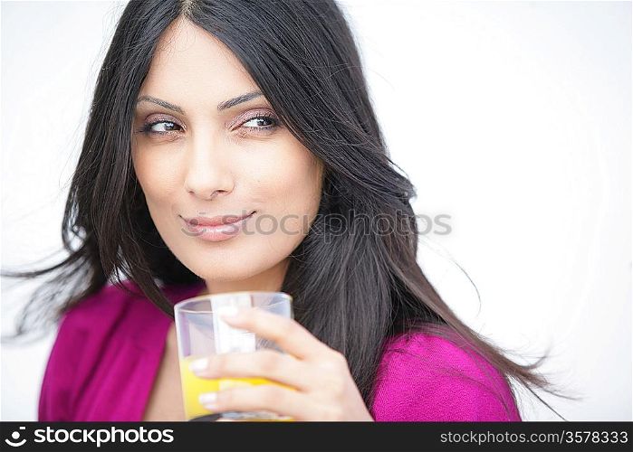 Attractive woman with a glass of orange juice