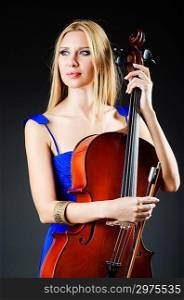 Attractive woman with cello in studio