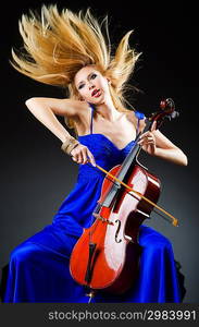 Attractive woman with cello in studio