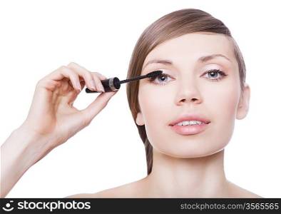 attractive woman with mascara brush on white background