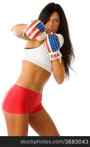 Attractive woman with usa boxing gloves in act to give a punch