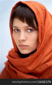 attractive woman with veil in the head a over blue background